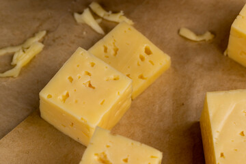 yellow semi-hard cheese with holes
