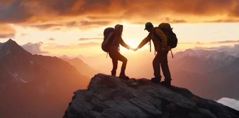 Fotobehang Climbers help friends reach the top of a mountain © didiksaputra