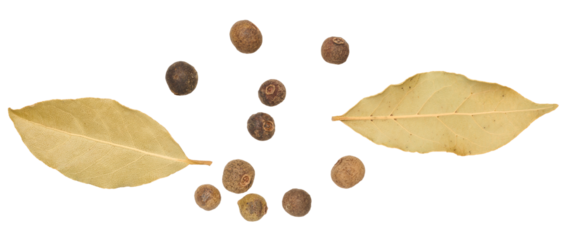 Bay leaf and allspice peas on isolated background, top view.