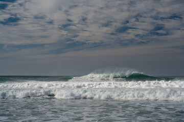 waves breaking on the beach