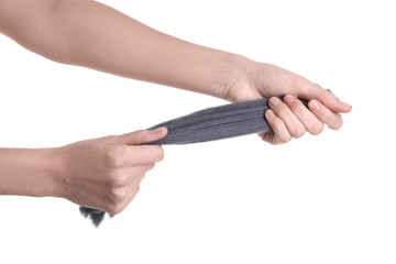 Woman holding grey felting wool on white background, closeup