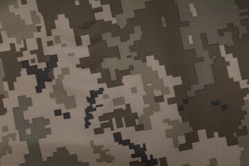 Texture of camouflage fabric as background, top view