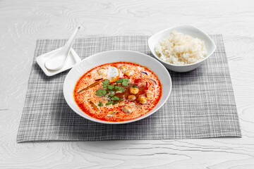 Tom yum soup with mushrooms and rice. Asia food.