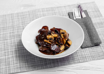 Seaweed with mushrooms and sesame seeds in soy sauce. Asia food.