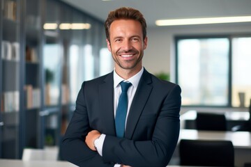 Fototapeta premium portrait of successful senior businessman consultant looking at camera and smiling inside modern office building