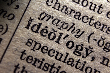 Word object ideology on book page, macro close-up	