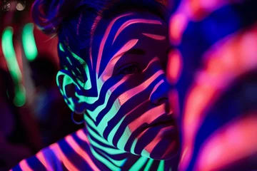 Rolgordijnen zebra stripes projected on a person with neon light © studioworkstock
