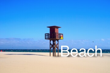 lifeguard tower at a wonderful beach, white beach lettering with shadow next to it, Atlantic Ocean,...