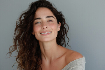 Happy attractive confident young adult or mid aged European woman posing for beauty aesthetic portrait. Beautiful lady smiling on background, attractive female model looking at camera. Close up face .