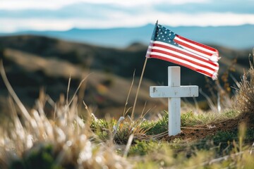 White cross in the grass on a hill with United States flag, Memorial Day holiday. - obrazy, fototapety, plakaty