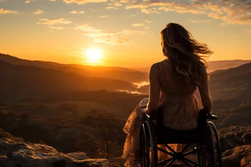 Tuinposter A touching scene unfolds as a girl with raised hands sits atop a wheelchair, triumphantly conquering a mountain peak, symbolizing resilience and determination in the face of adversity © Dejan