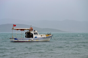 Fototapeta na wymiar fishing boat in the sea at cesme, izmir