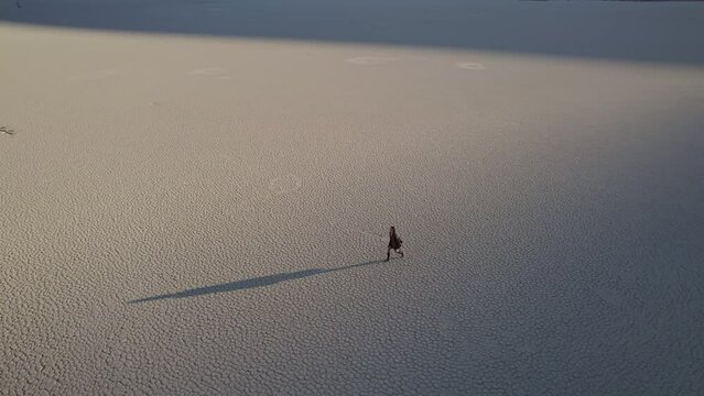 walking on dried up lake in DeadVlei in Namibia
