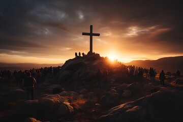 In a tranquil setting, a cross stands proudly at the summit of a hill, framed by the radiant hues of a sunset and a picturesque sky