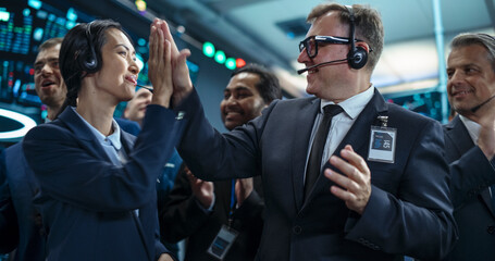 Team of Happy Investment Bankers Applauding, Celebrating and Congratulating Each Other on a...