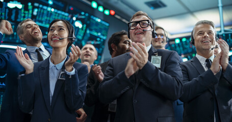 Group of Successful Stock Exchange Brokers Celebrating a Profitable Investment Bid on a Securities...