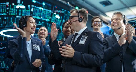 Team of Happy Investment Bankers Applauding, Celebrating and Congratulating Each Other on a...