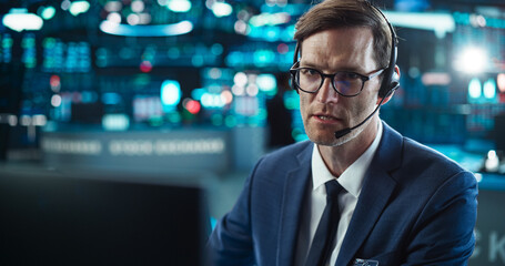 Close Up Portrait of a Smart and Thoughtful Stock Exchange Broker. Adult Man in Glasses Looking at...
