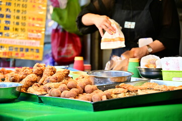 Taipei, Taiwan - Jan 16, 2024:At the market's fried food stand, the owner sells a variety of fried...