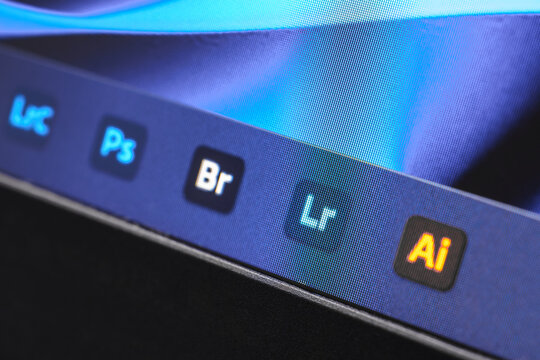 Uzbekistan, Tashkent - January 27, 2024: Application icons for Adobe Illustrator, Photoshop, Bridge and Lightroom on a computer screen with Windows.
