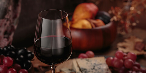 Glass of rich red wine served with cheese plate and fruits on dark wooden background. Appetizers table with wine glasses, rustic style table setting in winery