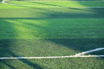 artificial green grass soccer field with white line