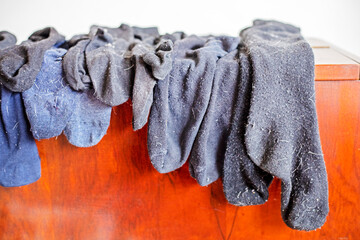 washed men's black socks in wool on the closet. Cleaning the house