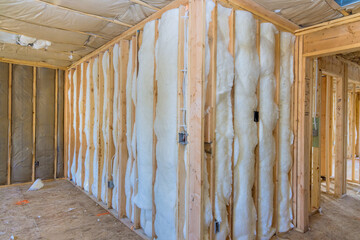 New residential home is being constructed with an insulation wall