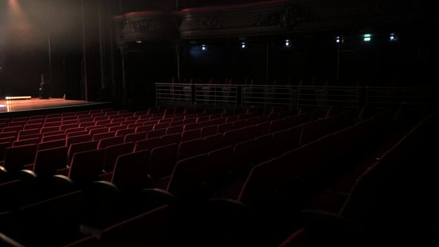 Empty theatre/concert venue with red seats