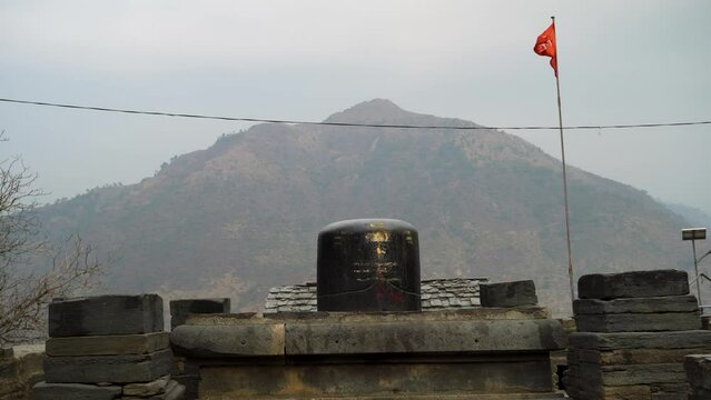 Big Shiva Linga Sculpture: Lakhamandal Temple, Himalayan Mountains Background