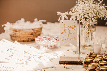 Wedding favors and wedding bubbles on a decorated table of a wedding.