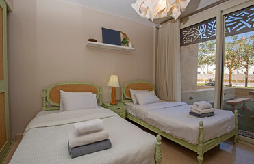 Interior design of bedroom in house with garden view