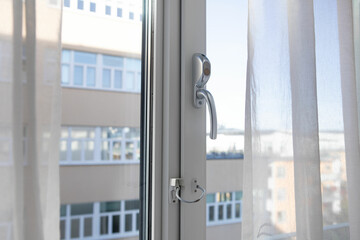 Lockable window handles for inward opening windows. window with handle with security key