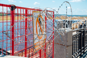 Fence with barbed wire. No entry. The border is guarded