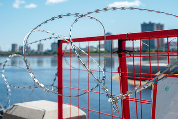 Fence with barbed wire. No entry. The border is guarded