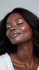Fototapeta premium Young adult African American woman posing for beauty portrait. Pretty smiling happy Black girl fashion model smiling on background, attractive ethnic girl looking at camera. Close up face .