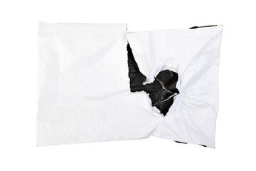 Torn white plastic parcel bag isolated on white background. View from above. Open package.