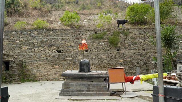 Granite stone Shivalinga's at Lakhamandal Shiva Temple. It shines like a mirror and reflects the surrounding view.