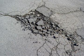 Road damage after frost in winter