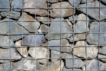 Natural stone wall with iron grille