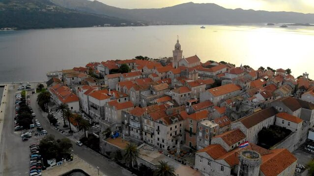 Korcula croatia aerial skyline view fly over korcula old town sea view at sunset.