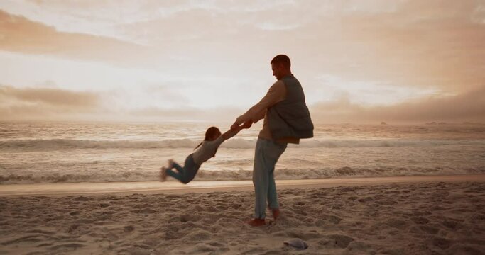Father, swing and child at beach for vacation with sunset, balance and strong for bonding, care and love. Person, dad and kid with game, lift or playful by ocean on holiday for connection in winter