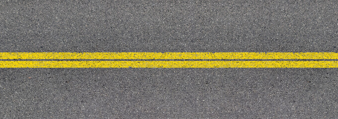 Lignes jaunes sur asphalte 