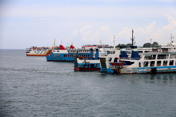 Ferries sail on the sea, ferries in the Bali Strait as a means of transportation between islands in...