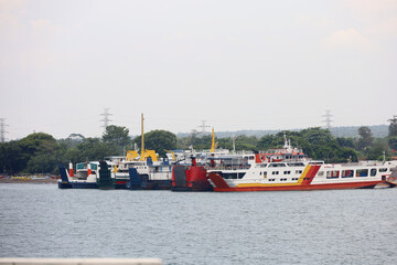 Ferries sail on the sea, ferries in the Bali Strait as a means of transportation between islands in Indonesia. inter-island logistics and economic crossing and shipping modes.