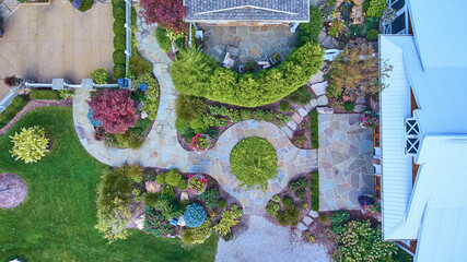 Aerial View of Lush Residential Garden with Stone Patio and Gazebo