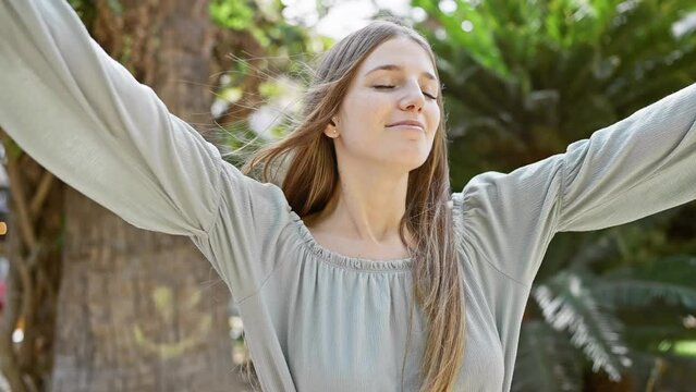 A serene young woman enjoying a moment of tranquility in a lush garden setting, exuding natural beauty and peacefulness.