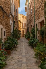 vertical view of a picturesque village street in the quaint mountain town of Fornalutx in northern Mallorca