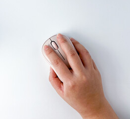 Hand holding cordless wireless usb mouse. Object photography isolated on white studio background. - obrazy, fototapety, plakaty