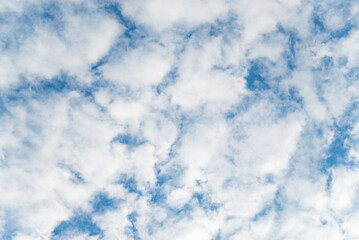 Elegant white clouds and blue sky background. Clouds spreading on the sky in sunny day. Glowing...